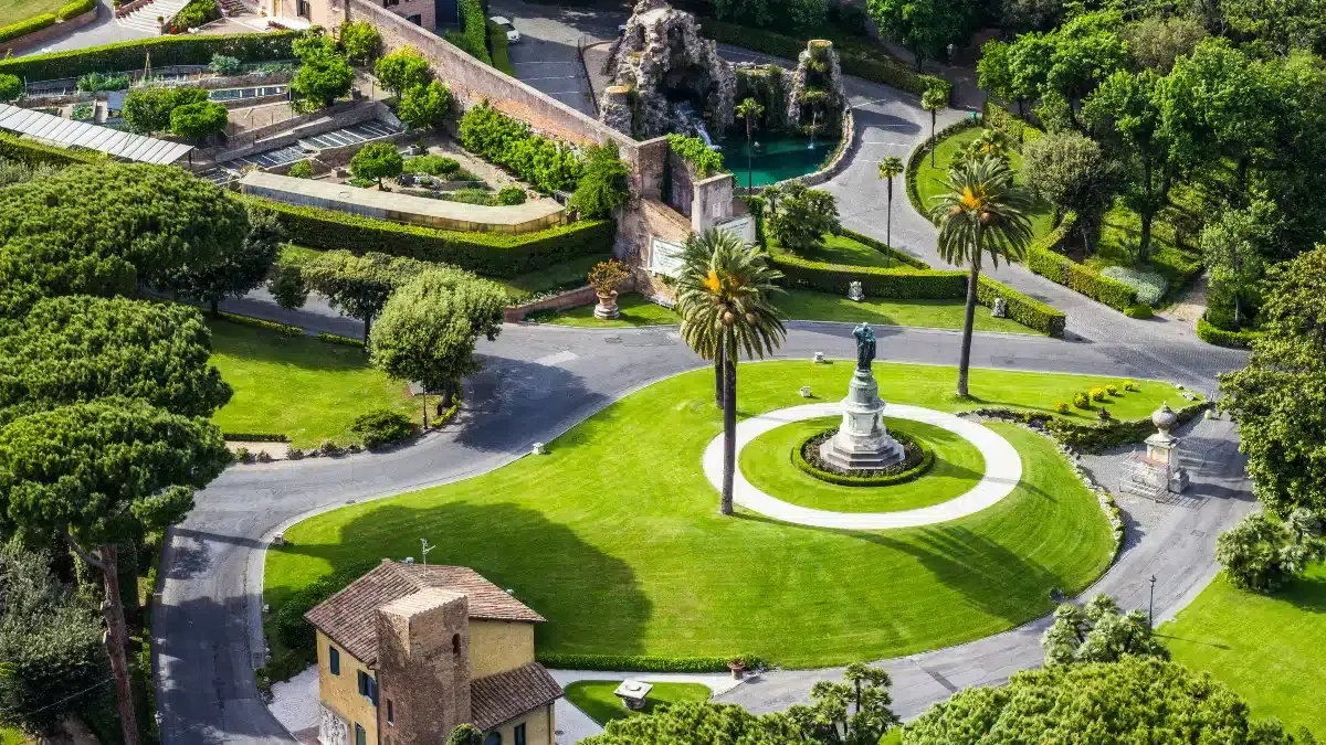 Lush Gardens of Vatican City!|Gardens of Vatican City|Dress Code|The Berlin Wall|Lourdes Grotto |Papal Court of Arms|Views of St. Peter’s Dome|why visit Vatican Gardens